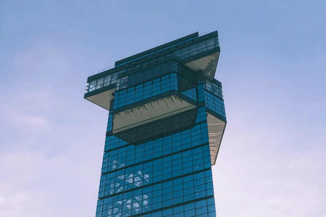 a tall building with glass windows