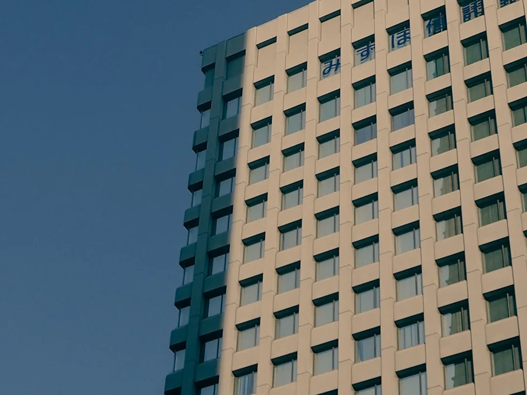 a very tall building with a clock on it's side