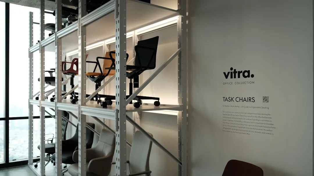 Office chairs are showcased on shelves in a store.